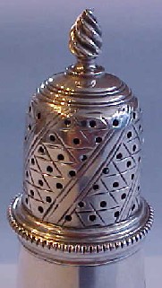 Detail of the top of Detail of the top of the  superb Georgian sterling silver pepper caster, London 1768.